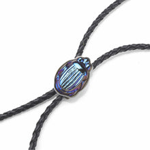 Load image into Gallery viewer, Closeup on the Pontiel Jewelry | Handmade Marks Bolo Tie with Egyptian Revival Scarab Glass
